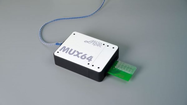 Photo of the Sciospec ISX-3 impedance analyzer connected to a modular multiplexer (MUX) unit with multiple input channels—designed for scalable, high-throughput physiological measurements across subjects or anatomical sites.