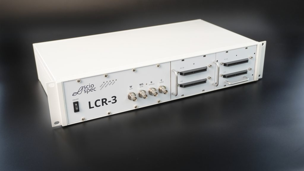 Multiple Sciospec LCR-3 modules configured for parallel, high-throughput testing with stackable multiplexers.
